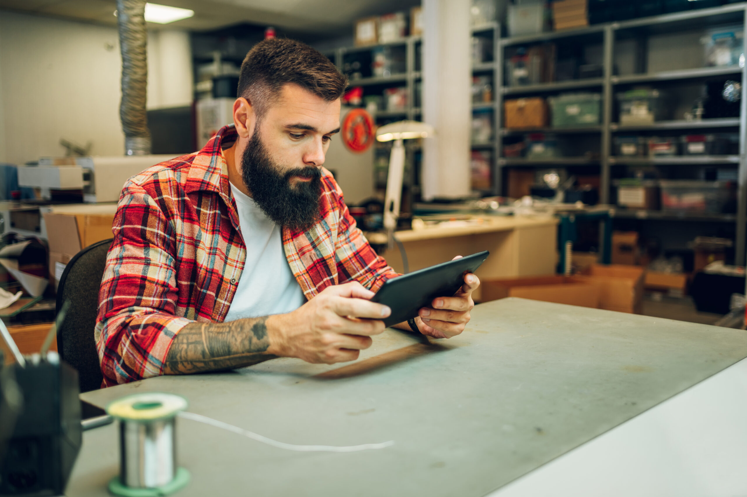 electronics engineer working in a professional workshop and usin
